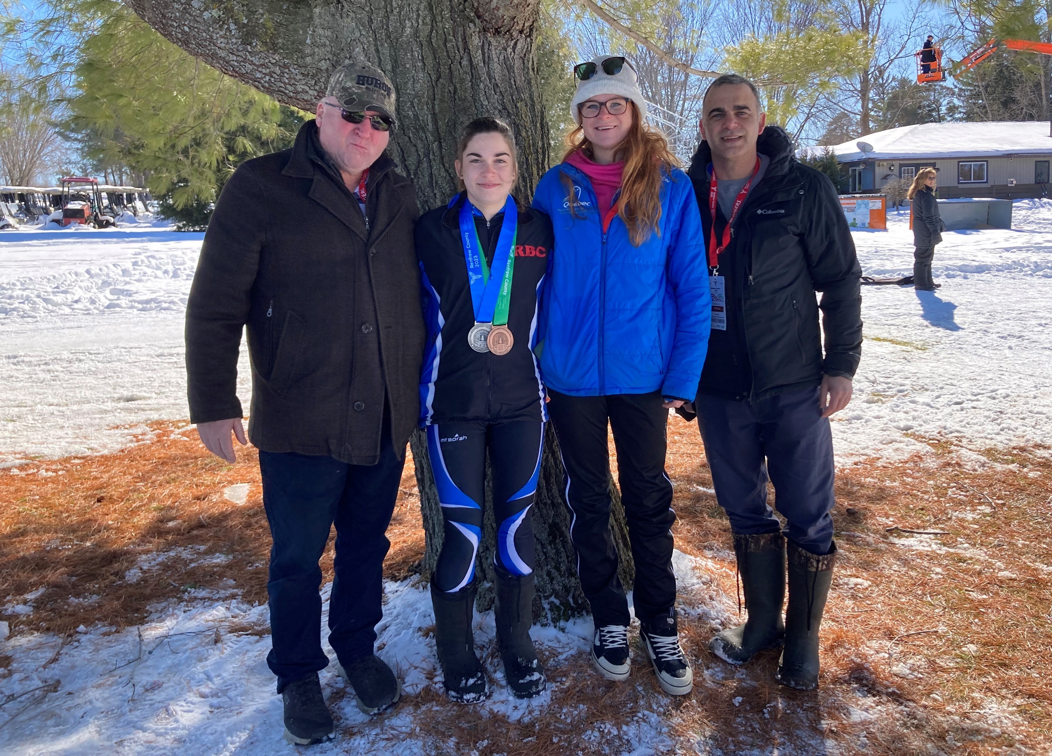 Annie with her medals and trainers