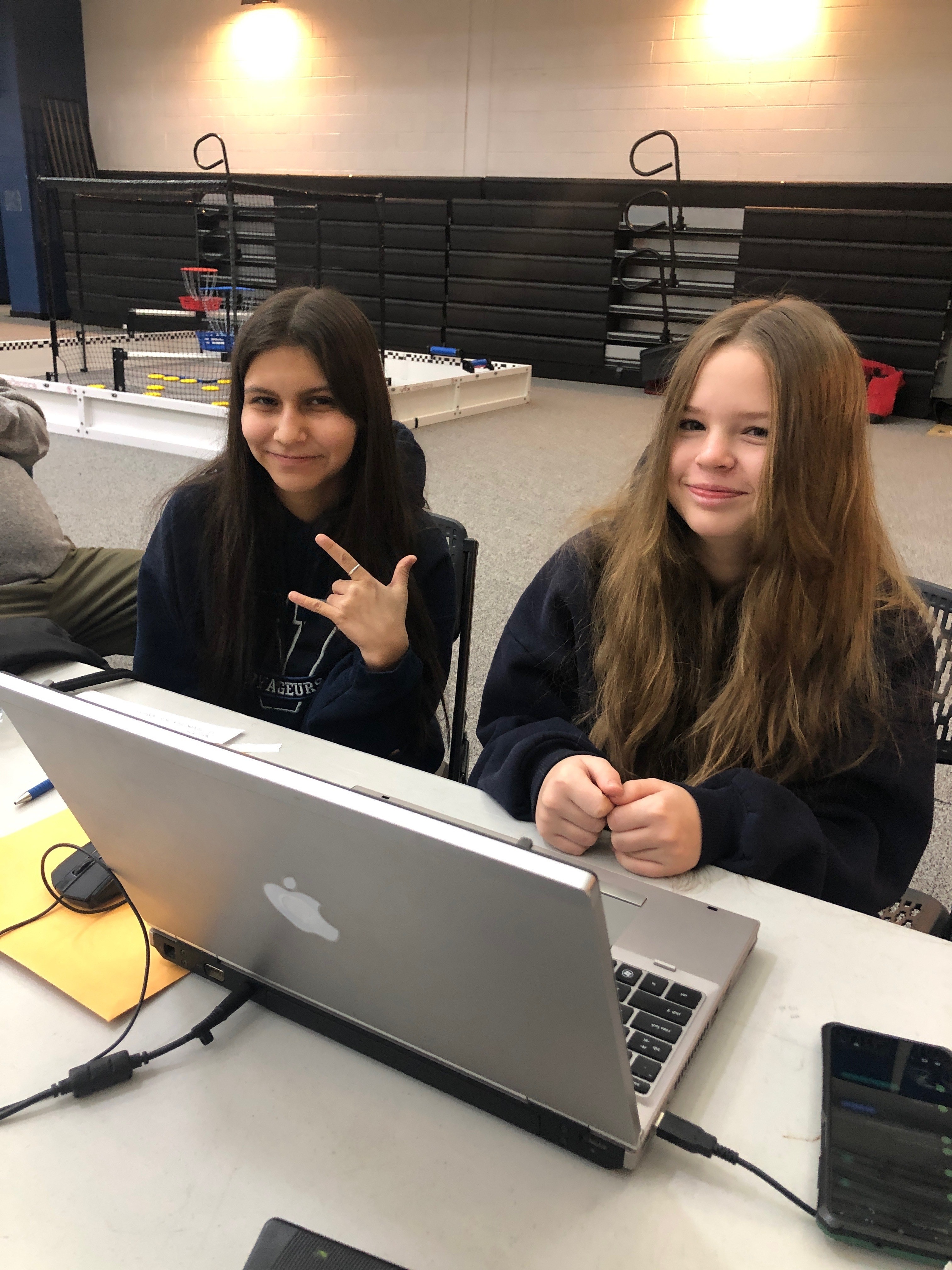 Sophie Barrette and Gabriella Gutierrez working on a computer